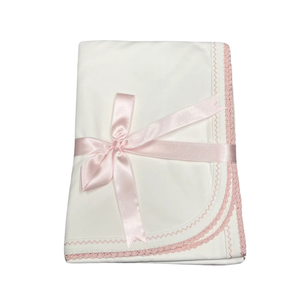 White blanket w/ pink trim